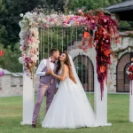 wedding-archway-backyard-happy-wedding-couple-outdoors-before-wedding-ceremony_8353-11057